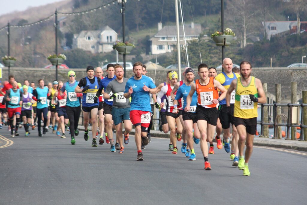 People running a race in the town of Looe