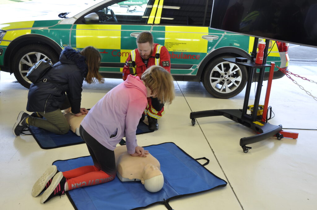 Children test out their CPR skills 1