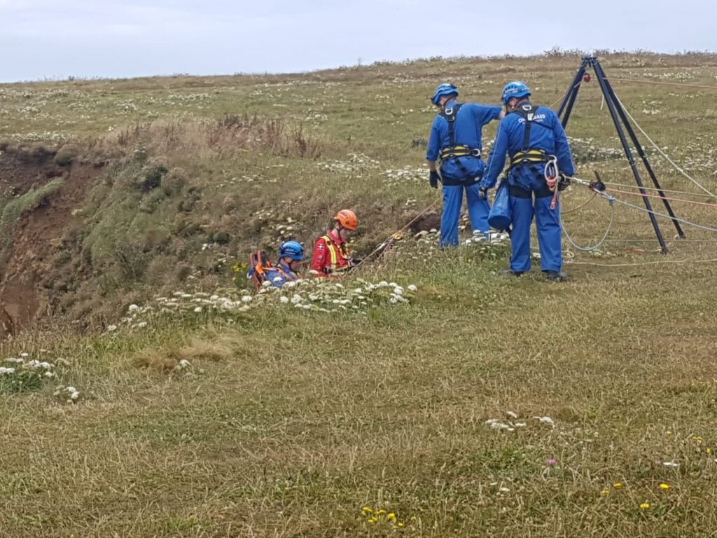 Dr Dave Ashton Cleary from CAAT is helped by Newquay Padstow Coastguard teams