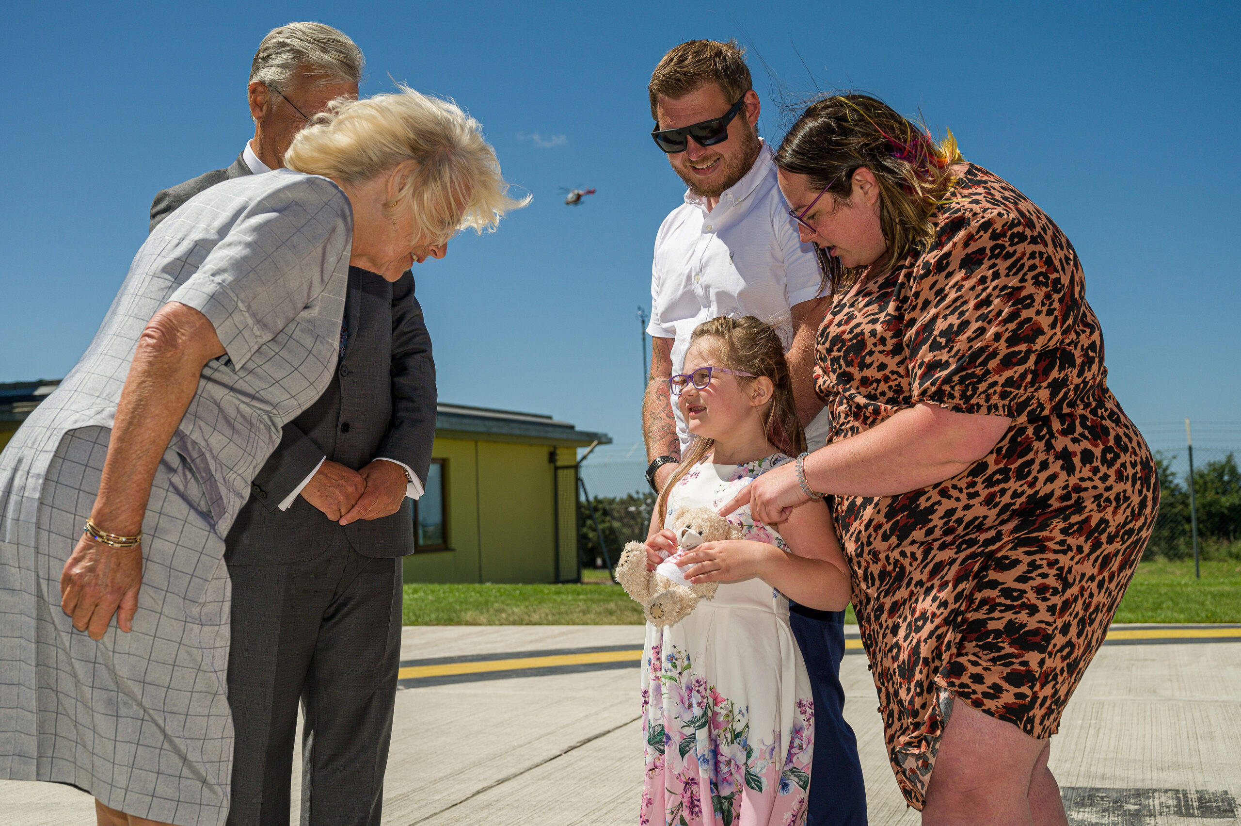 The Duchess of Cornwall meeting airlifted patient Leya along with parents Casey and Daniel Raper scaled