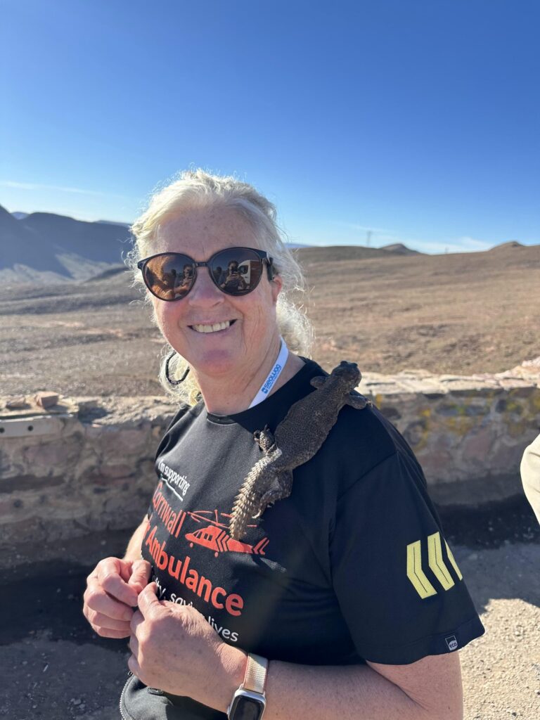 a woman smiling at the Sahara Desert