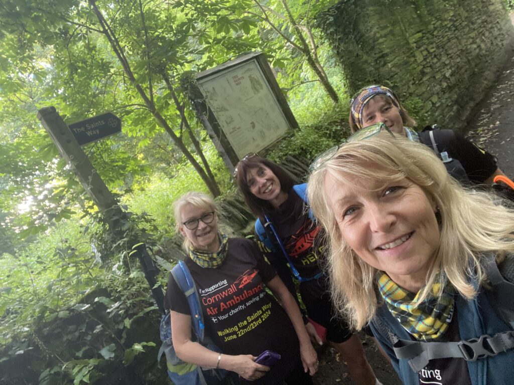 Lynnette and her three female friends in walking gear on the Saints Way.